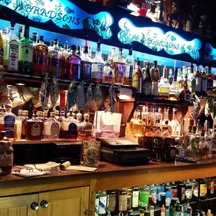 many bottles of alcohol on shelves