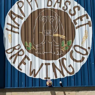 a man standing in front of a sign