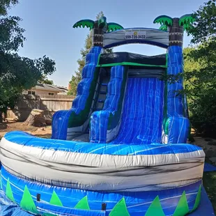 16 ft palm tree water slide. www.Happybouncehouse.com