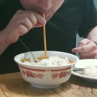 Our friend literally drinking the curry with a straw