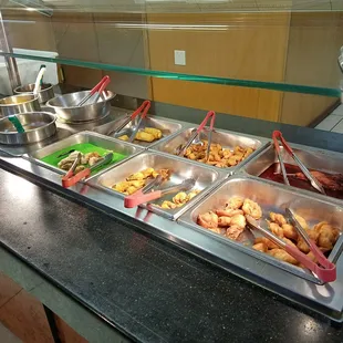 a variety of food items in a buffet