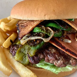 Our New Famous Deluxe Burger! It includes Bacon, Long Green Chiles, Weenies, Grilled Onions, Grilled Jalapeños and Avocado! Yummmmmmm!