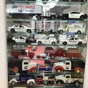 a display case full of toy cars