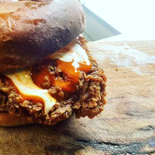 a meat sandwich with cheese and sauce