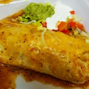 The lunch burrito smothered with mild green chile.