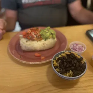 Steak El burrito with side of rice and beans and onion