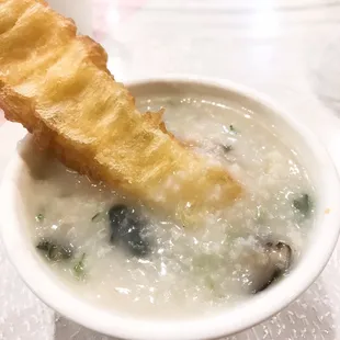 Pork and century egg congee with fresh breadsticks