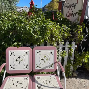 two chairs in front of a sign