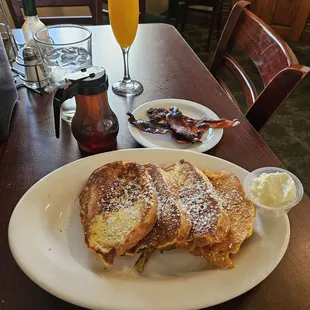 French toast with side of bacon and Champagne mimosa