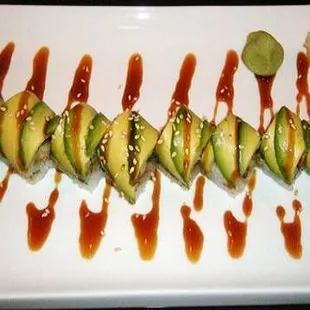 Dragon roll- with eel and cucumber inside wrap with avocado. Yum!