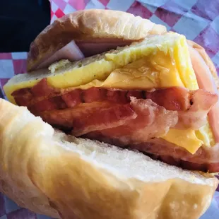 HOT Ham, bacon egg &amp; cheese on croissant to go! YUM! :)&apos;
