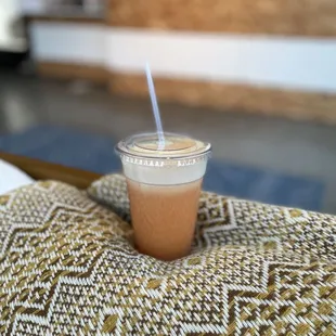 a plastic cup with a straw on top