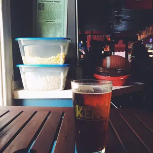 a pint of beer on a table