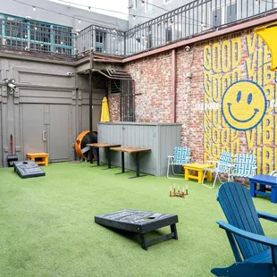 a patio with chairs and tables