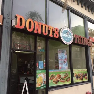 Crossaint breakfast sandwich and donut with sprinkles