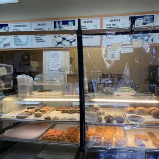 a display case filled with donuts