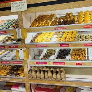 a variety of donuts in a display case