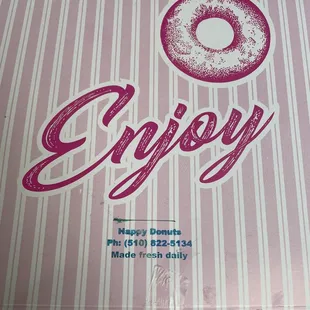 a pink box with a donut on it