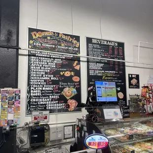 menus on the wall above the counter