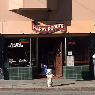 a fire hydrant in front of a restaurant