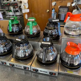 a woman preparing coffee in a coffee shop