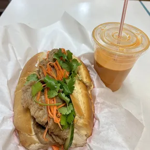 a sandwich and a drink on a table