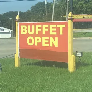 a sign for a buffet open