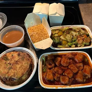 General Tso Tofu, Garlic Broccoli,Vegetable Egg Foo Young all with Spicy Fried Rice. Always sooo dang on Delicious!! Luv this place!