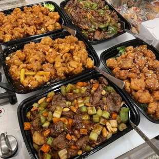 a variety of chinese food being prepared