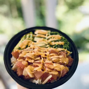 a person holding a plate of food