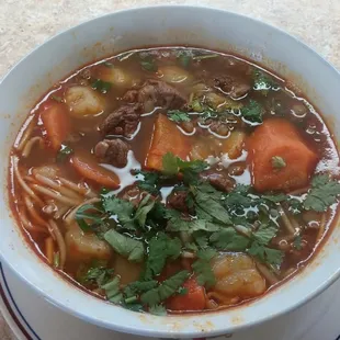 a bowl of soup on a plate