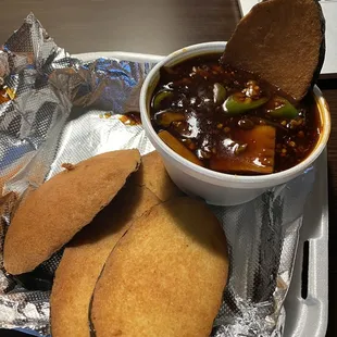 Fish with brown sauce.