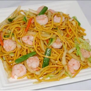 a plate of noodles and shrimp