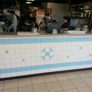 Can see them cooking. Lady ia making wontons