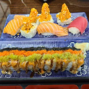 Nigiri sake, Maguro, Volcano roll,, Scallop roll in the front.