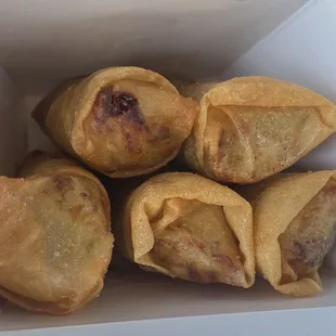 Looking at the Egg Rolls in the to-go box.