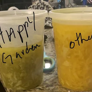 two cups of juice on a kitchen counter