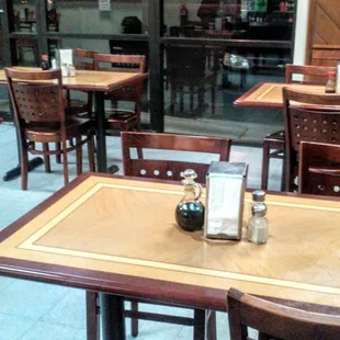 Simple dining tables..other side occupied by owner's family