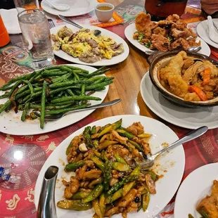 Counter-clockwise from bottom: Chicken asparagus, green beans, scrambled egg beef, salt pepper pork, tofu fish clay pot