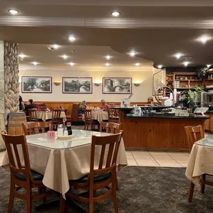 a dining area with tables and chairs