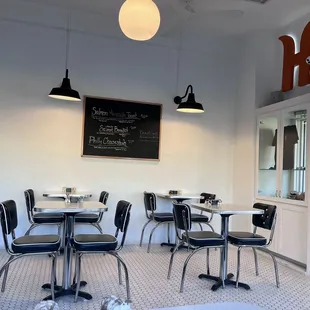 a restaurant with tables and chairs