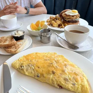 Omelet with comes with toast and choice of fruits (grapes, orange slices) or home fries.