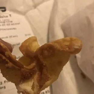 a hand holding a pastry