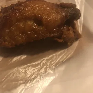 a piece of chicken on a piece of tin foil