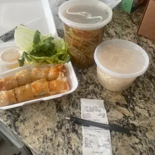 Beef noodle soup and spring rolls.