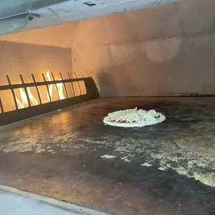 a pizza cooking in an oven