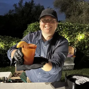 Certified Bartender in California serving the guests Dia de los Muertos themed drink