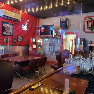 a bar with tables and chairs