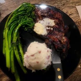 The steak is med well,brocoliini,mashed potato