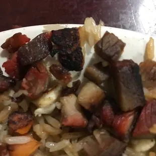 Burnt rice and crispy pork --tasted awful.  Told the waitress/cook it tasted burnt and was told I am too picky.  Pictures don't lie. BURNT!